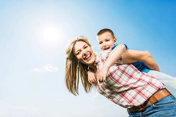 istock Mother piggybacking her son. 471785745