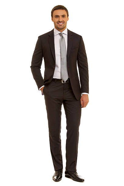 istock Well-dressed man. Charismatic businessman standing on white background 471786814