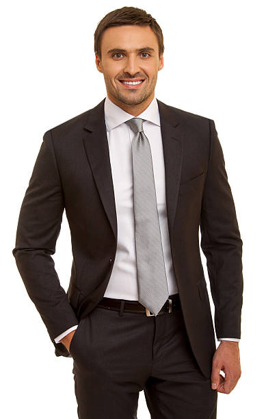 istock Well-dressed man. Charismatic businessman standing on white background 471786818