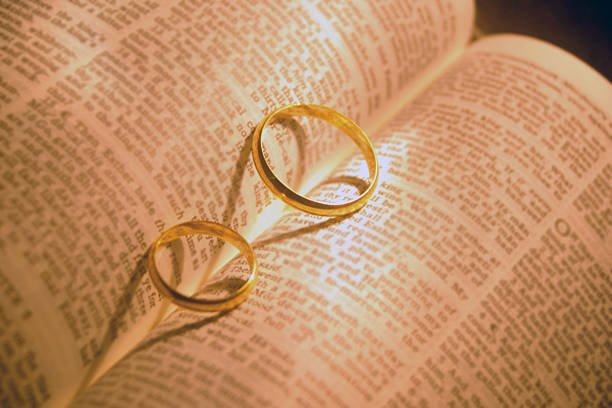 istock two wedding rings with a heart shadows 471786903