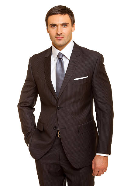 istock Well-dressed man. Charismatic businessman standing on white background 471786918