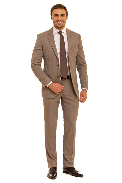istock Well-dressed man. Charismatic businessman standing on white background 471786950