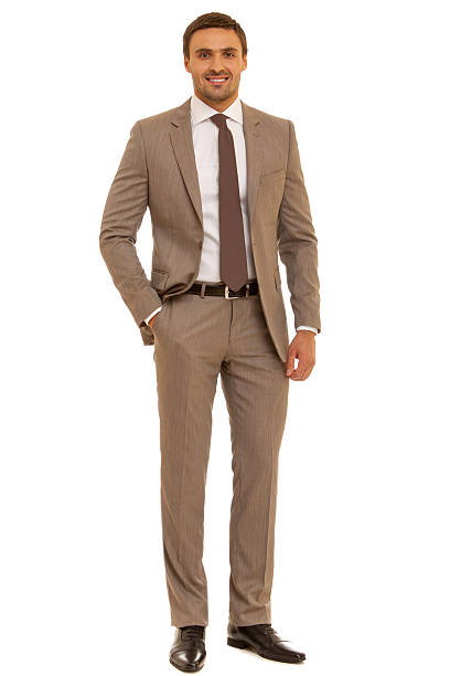 istock Well-dressed man. Charismatic businessman standing on white background 471786952