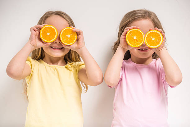istock Two young girls having fun and playing  471787974