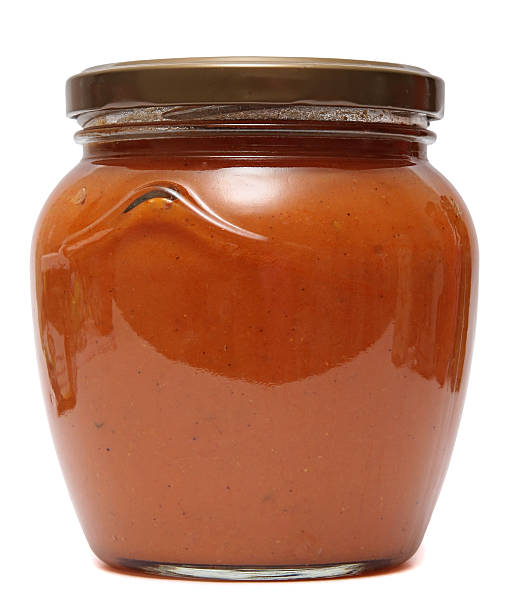 istock Squash caviar in glass jar isolated on white background 471789034