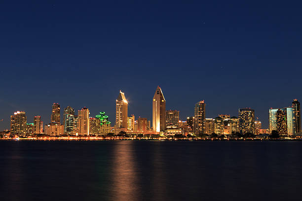 istock Illuminated San Diego skyline on horizon at nighttime 471789130