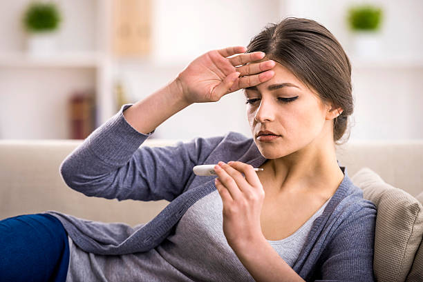 A woman who is worried that she might have a disease  stock photo