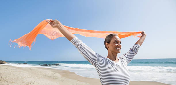 istock Happy senior woman enjoying the wind 471790245