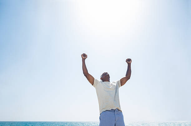 istock Senior man raising arms 471790281