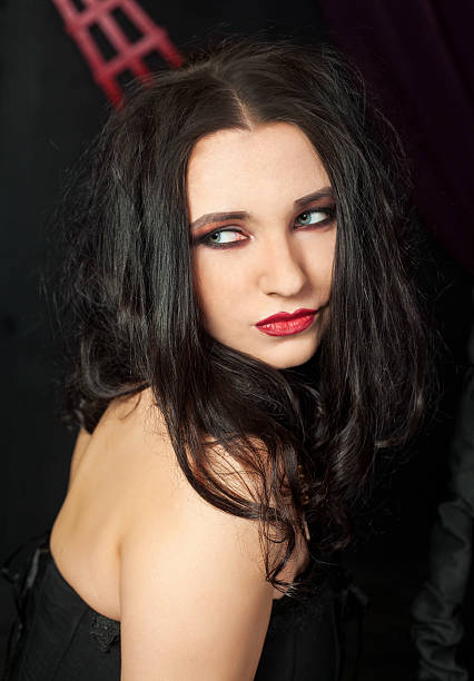 istock Young beautiful woman in black 471790810