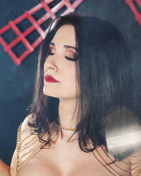 istock Young beautiful woman with chains 471790816