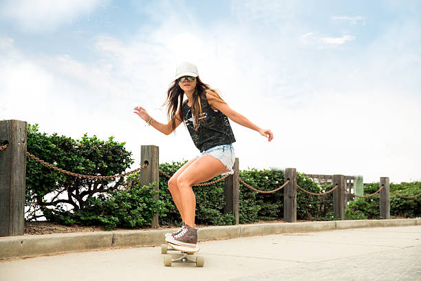 Girl riding her skateboard.
