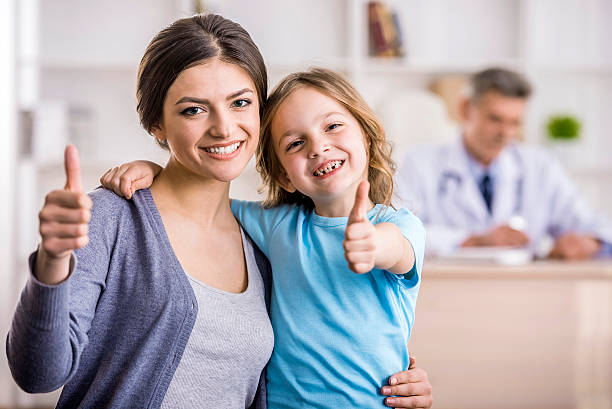 istock Mom with kid at the doctor. 471791224