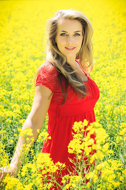 istock Beautiful blonde in oilseed Rape 471791419