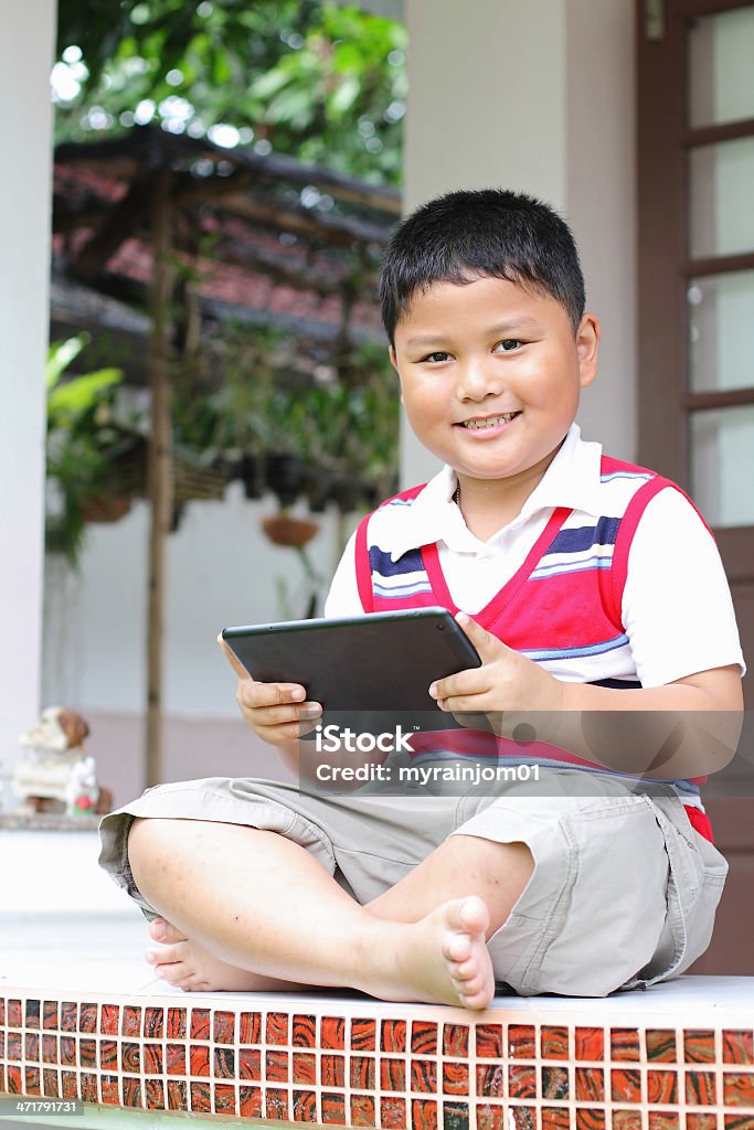Tablet boy playing fun. Boys Stock Photo