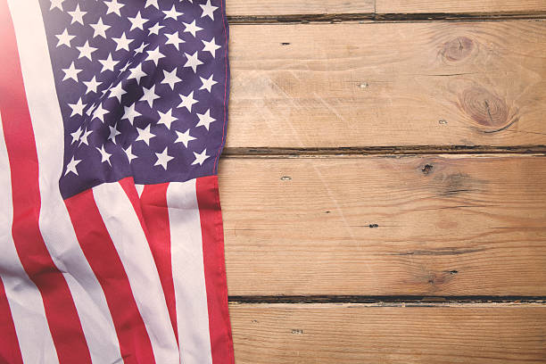 istock American flag on wooden background 471792893