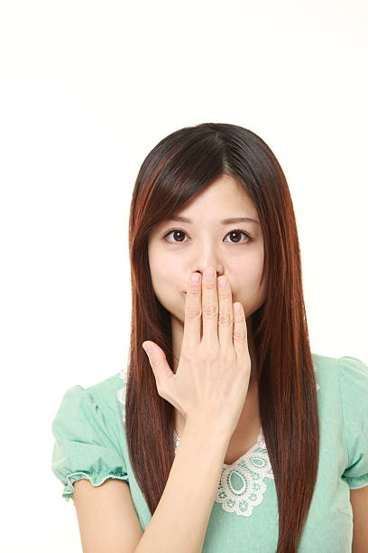 istock Japanese woman making the speak no evil gesture 471795444