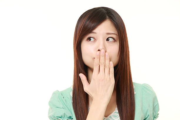 istock Japanese woman making the speak no evil gesture 471795448