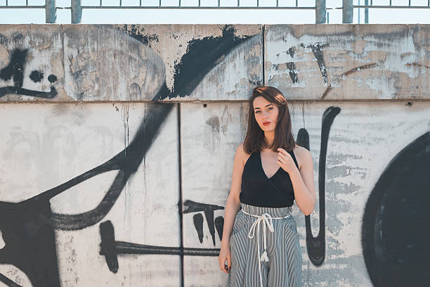 istock Beautiful brunette posing in an industrial context 471796070