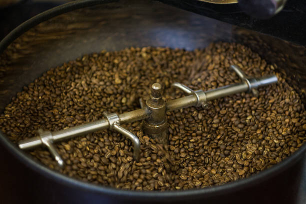 caffè da forno - roasted machine bean mixing foto e immagini stock