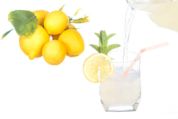 Pouring lemonade stock photo