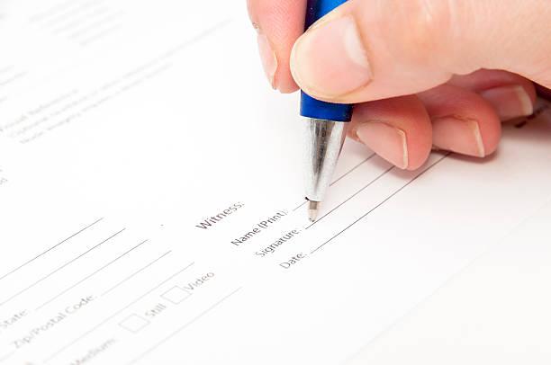 hand signing an agreement