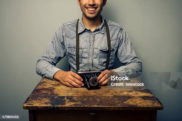 Trendy Man With Vintage Camera At Old Desk Stock Photo - Download Image Now - Adults Only, Asian and Indian Ethnicities, Camera - Photographic Equipment