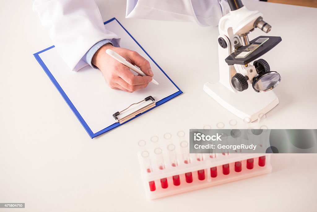 Laboratory Scientist concept. Scientist working in laboratory with microscope. 2015 Stock Photo