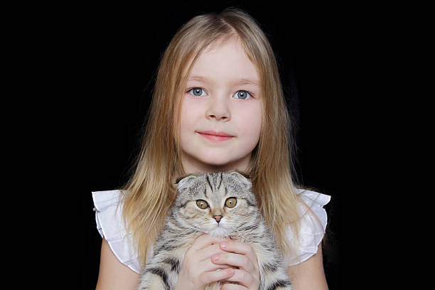 istock Girl with grey kitty 471805133