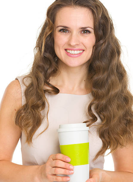 istock Happy young woman holding coffee cup 471805969
