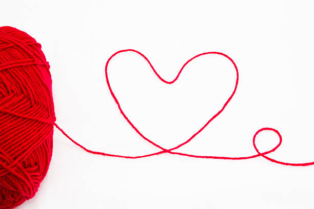 istock Wool yarn with heart symbol 471807115