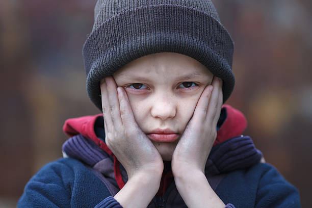istock dramatic portrait of a homeless boy 471807842
