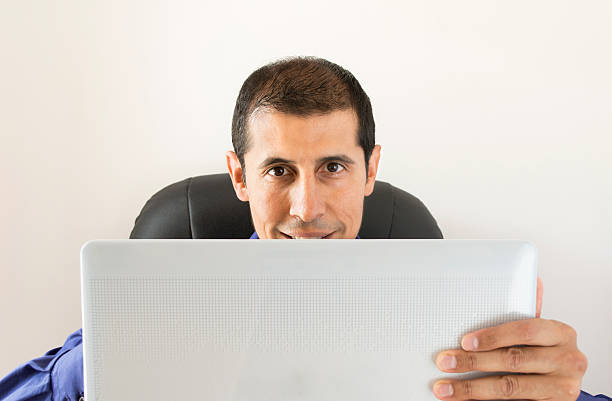 istock businessman holding a digital tablet 471808573