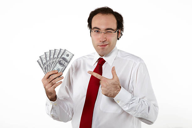 business man holding und zeigt-dollar - us currency single object one hundred dollar bill number 100 stock-fotos und bilder