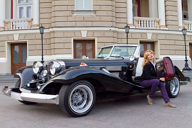 istock girl in an old car 471811981