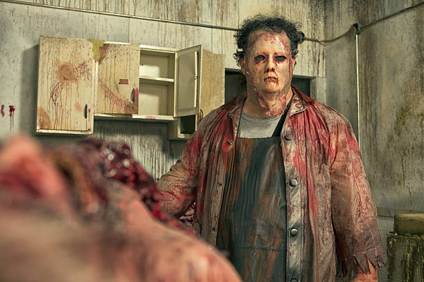 Psycho Butcher in his deadly kitchen Psycho Butcher in his deadly kitchen. This stock image has a horizontal composition in an old dirty kitchen. blood and guts stock pictures, royalty-free photos & images