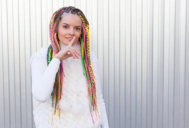 istock Beautiful girl with colored dreadlocks summer sunny day 471814054