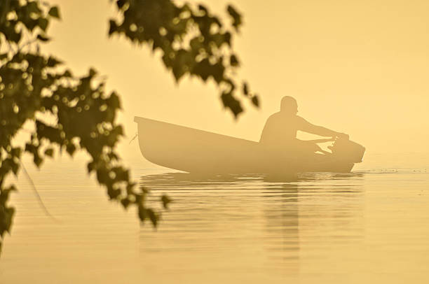 istock man on the river in fog 471815863