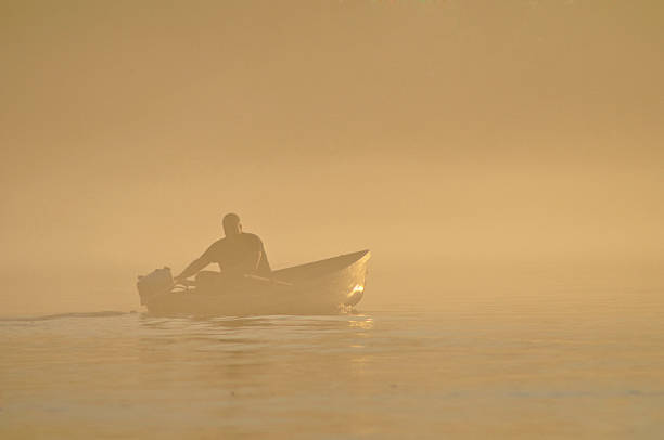 istock man on the river in fog 471815877