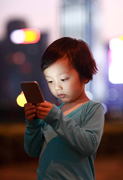 istock Boy Using Smart Phone in the nightBoy Using Smart Phone in the night 471816470