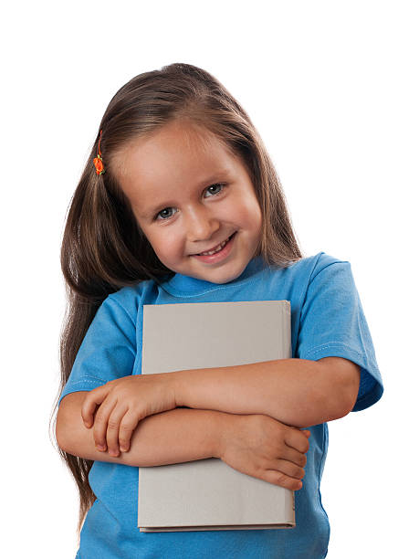 istock Girl holding a book. Isolated 471820237