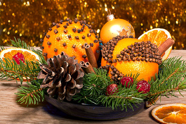 Christmas decorative composition with orange pomanders close ap Christmas decorative composition with orange pomanders close ap on a wooden background scent container stock pictures, royalty-free photos & images