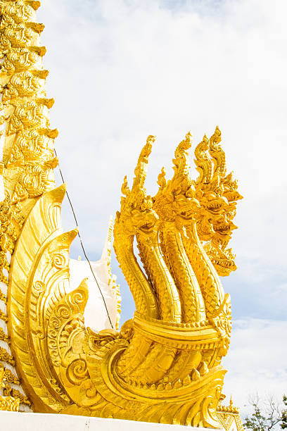 istock Thai dragon, golden Naga statue in temple 471821135