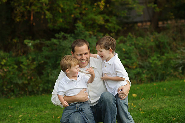 istock Father With His Sons Outside 471822693