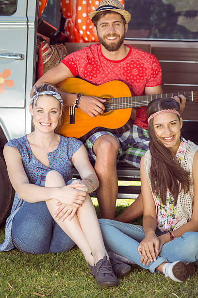 istock Hipster friends by their camper van 471823158