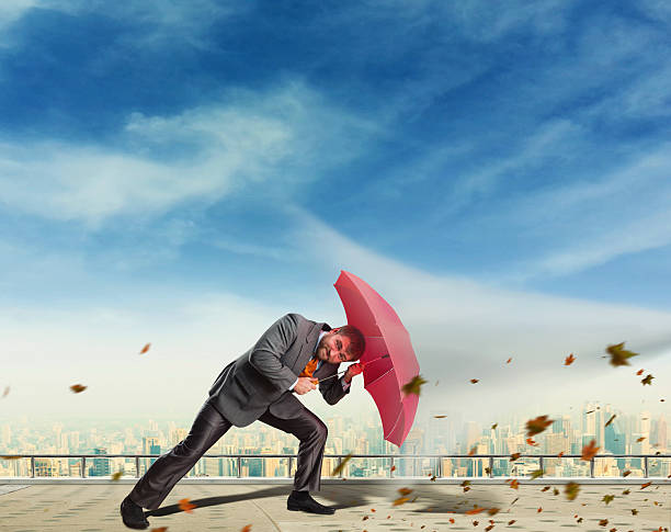 istock Businessman protects himself from crisis 471823404