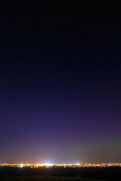 istock The starry sky above the lighted lanterns city. blur 471823868