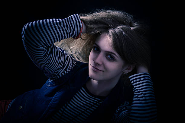 istock beautiful thoughtful girl close up in the dark 471824607