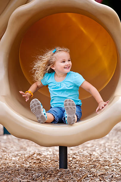 istock Girl on Playground Slide 471825005
