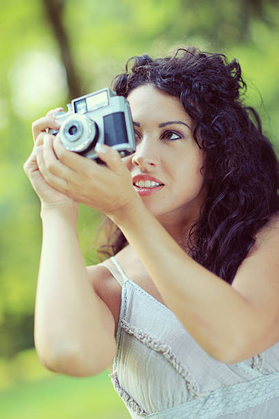 istock young woman taking a photography 471825501